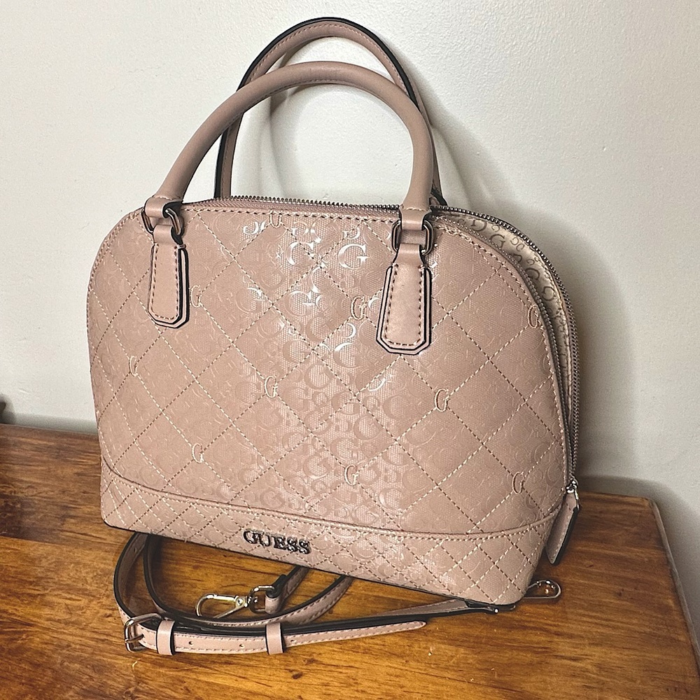 GUESS purse with a removable shoulder strap.